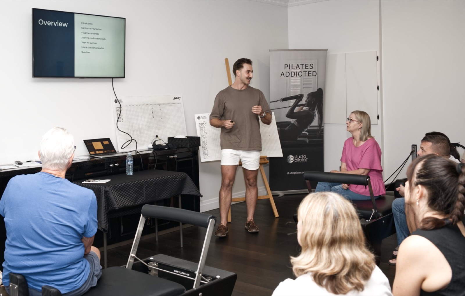 Guy Leggett teaching a workshop at a Pilates studio
